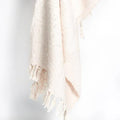 Soft cream woven throw blanket with fringed edges, Qu!rk Boutique sustainable home decor