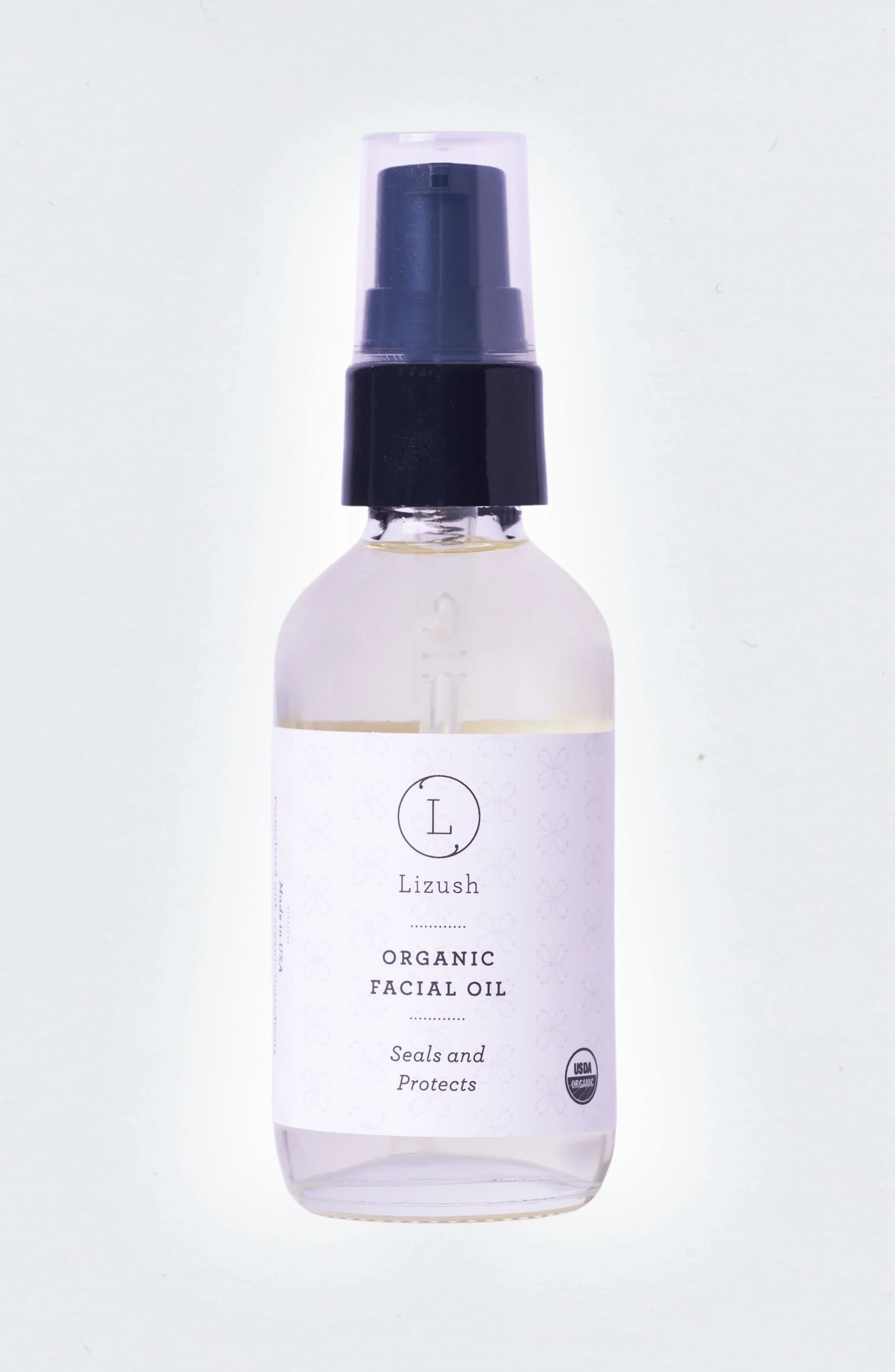 Lizush organic facial oil bottle with pump dispenser and USDA organic label