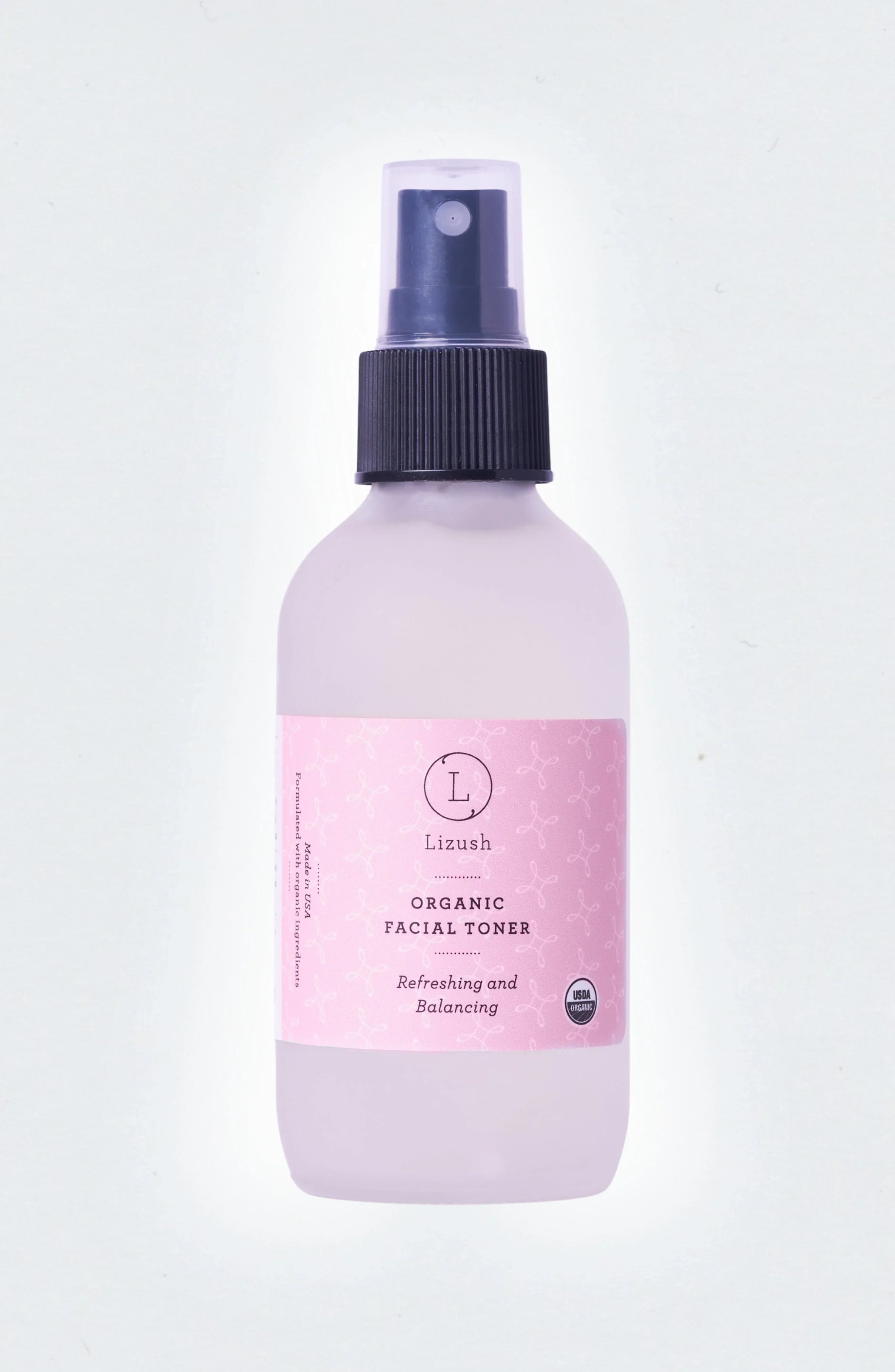 Lizush organic facial toner bottle with pink label and black spray cap, USDA organic seal