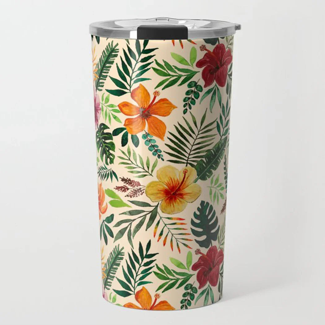 Insulated tumbler with tropical floral and green leaf pattern, stainless steel lid, beige background