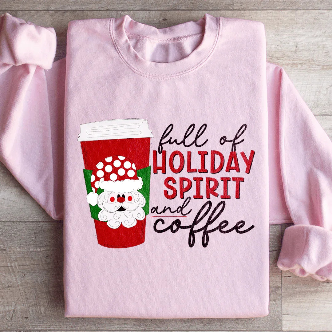 Pink sweatshirt with holiday-themed coffee cup graphic and text full of holiday spirit and coffee