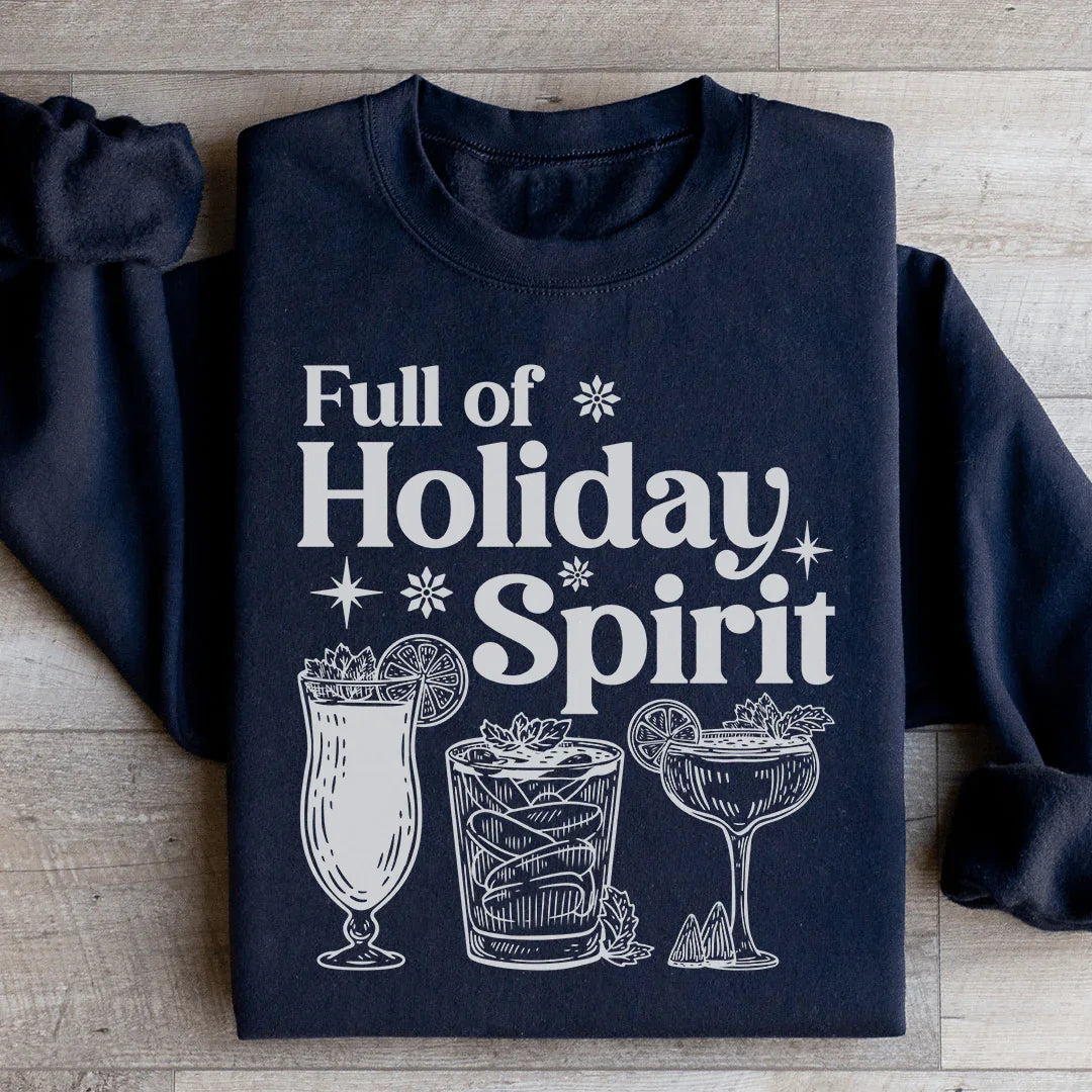 Black sweatshirt with white holiday-themed print reading Full of Holiday Spirit with festive cocktail illustrations