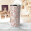 Pink floral insulated tumbler with clear lid on marble countertop in bright living room