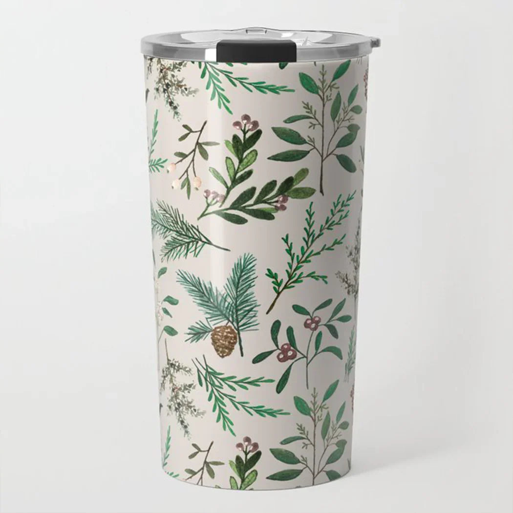 Tall insulated travel tumbler with silver lid and green botanical leaf and pinecone pattern on white background