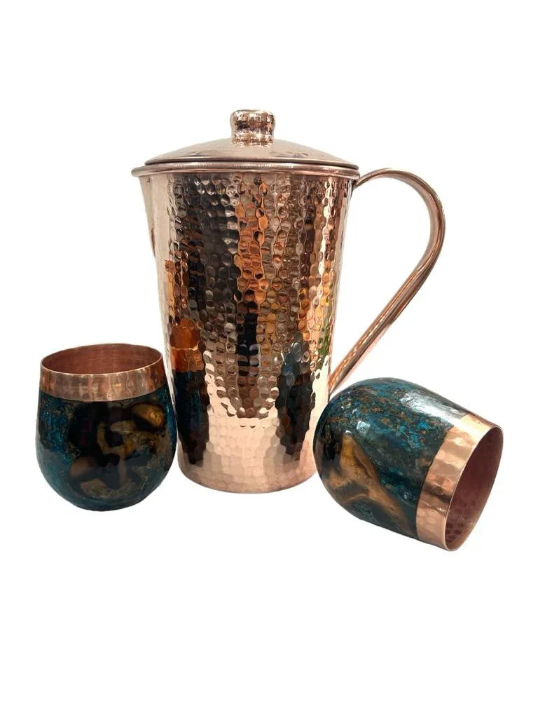Hammered copper pitcher with lid and two marbled blue and copper cups, Qu!rk Boutique giftware.