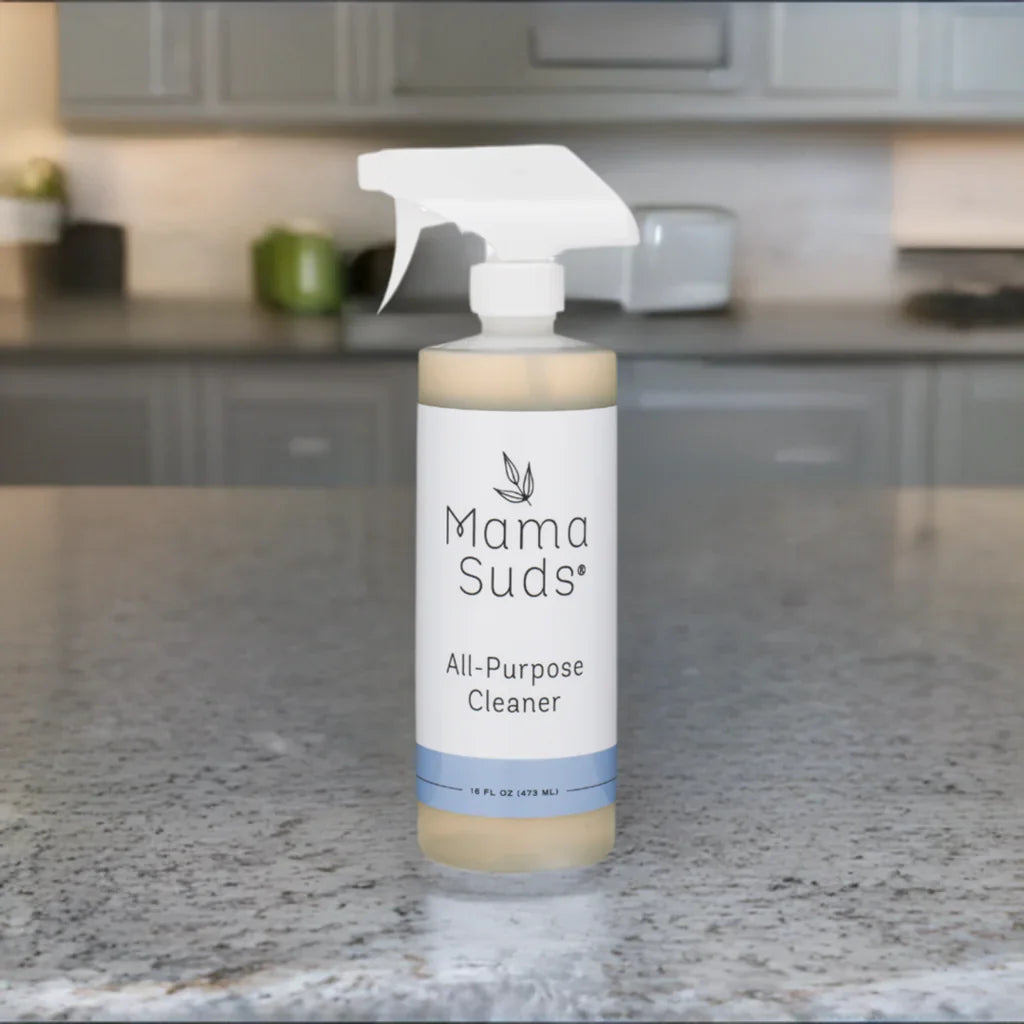 Mama Suds all-purpose cleaner bottle on a kitchen counter, eco-friendly boutique product