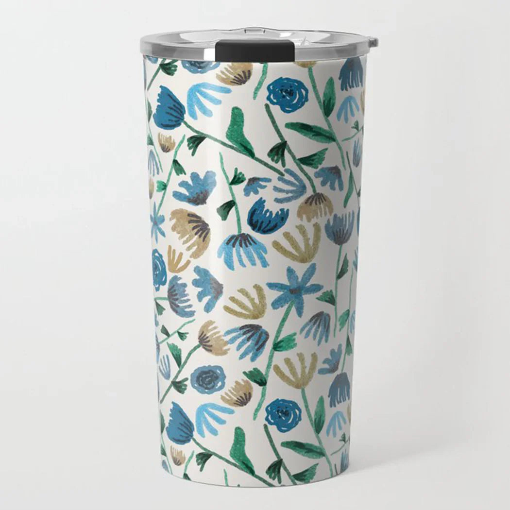 Tumbler with blue, green, and beige floral pattern and clear lid on white background