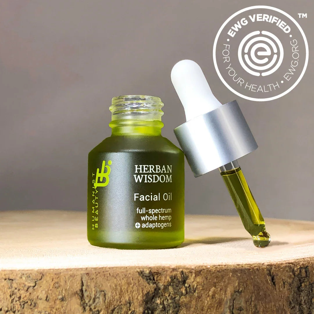 Herban Wisdom facial oil bottle with dropper on wood, EWG certified, at Qu!rk Boutique