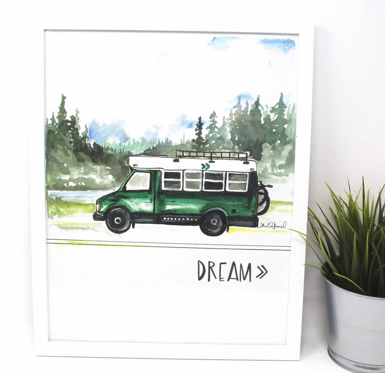 Watercolor art print of green van in forest, 'DREAM' text, displayed in white frame