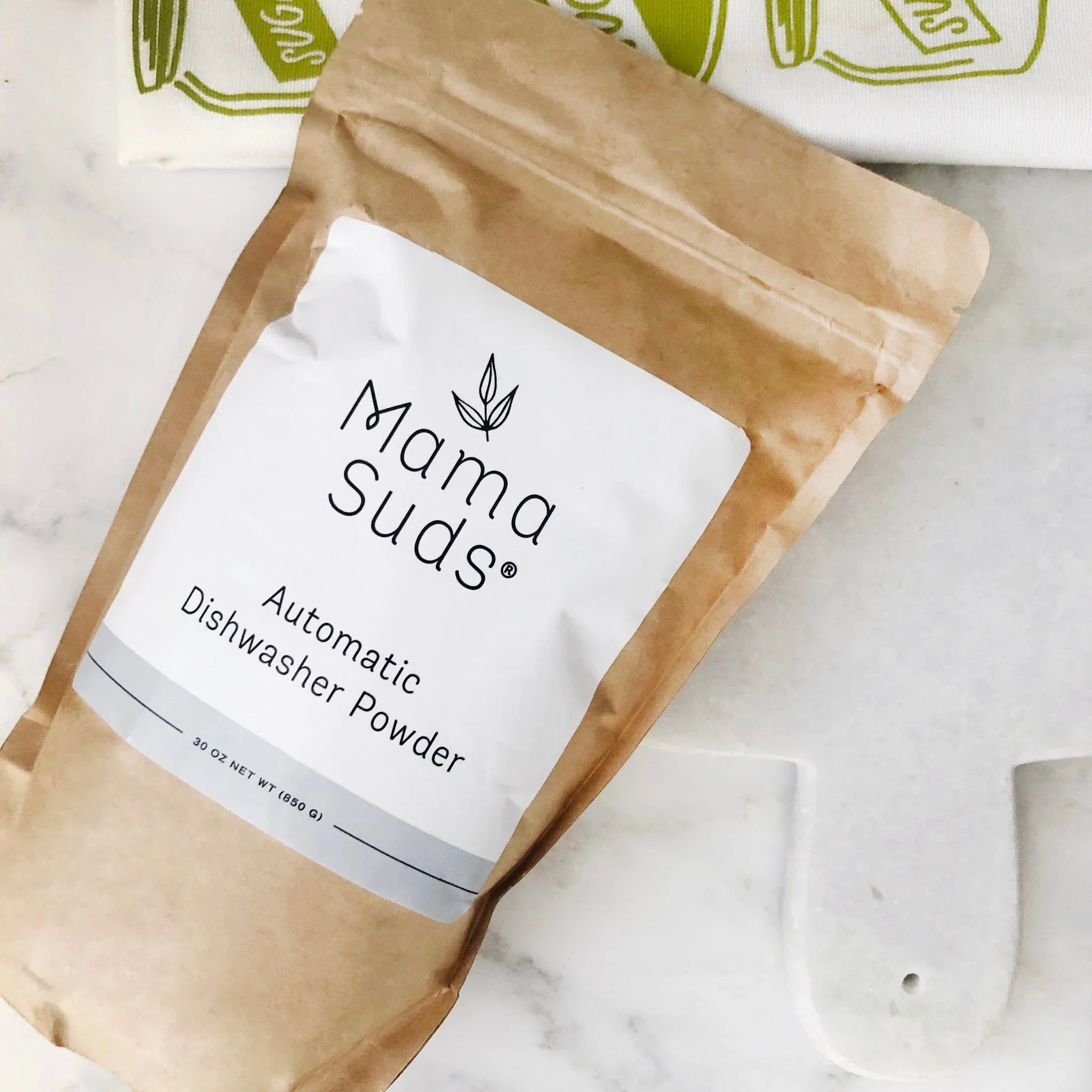 Mama Suds Automatic Dishwasher Powder eco-friendly packaging on marble counter, Qu!rk Boutique