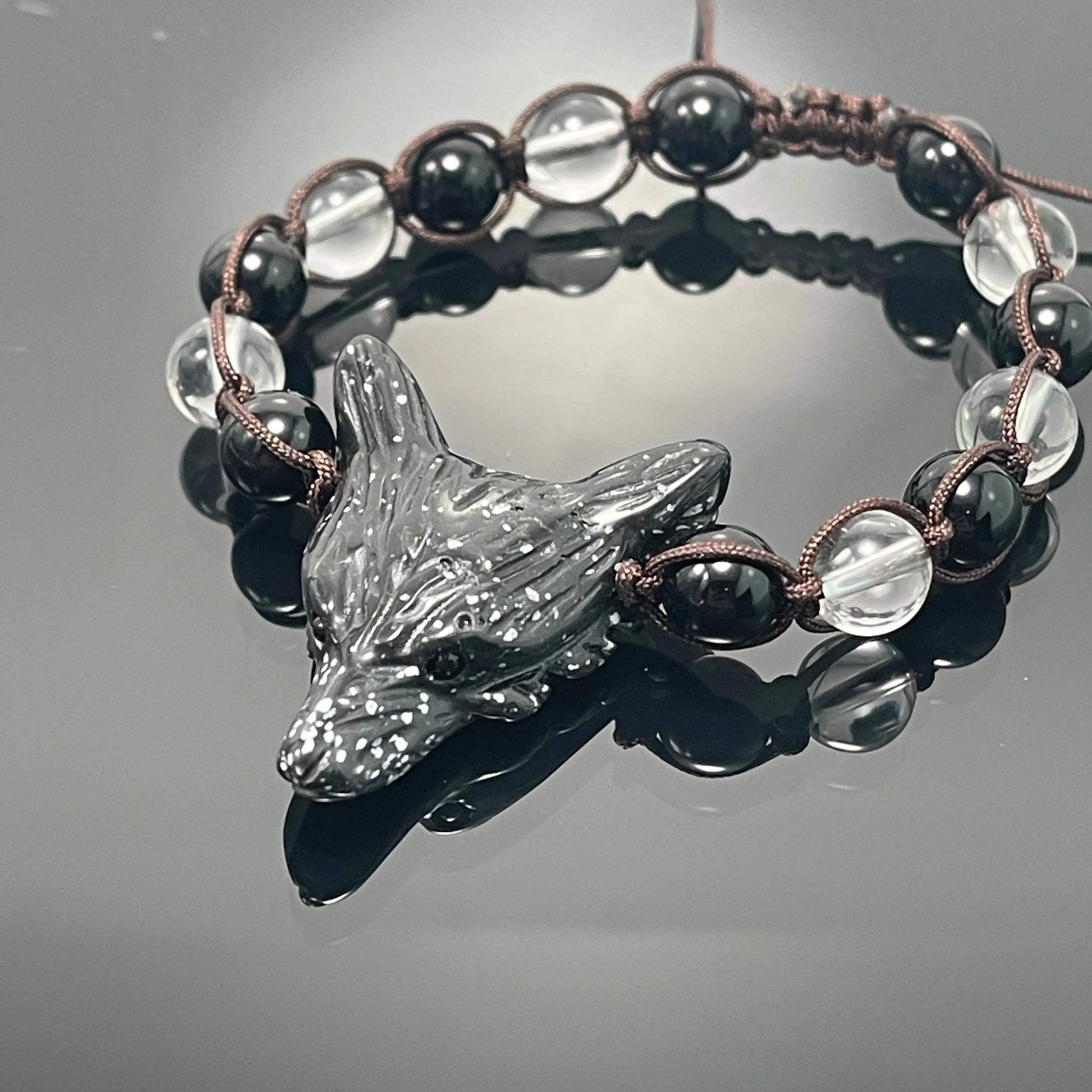 Wolf head bracelet with black and clear beads, cosmic artist-designed jewelry from Qu!rk Boutique