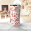 Tall insulated tumbler with pink rose floral pattern on white, stainless steel lid, on marble surface