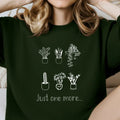 Dark green sweatshirt with white line art potted plants and 'just one more...' text, Qu!rk Boutique