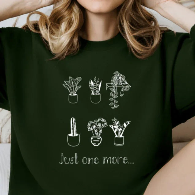 Dark green sweatshirt with white line art potted plants and 'just one more...' text, Qu!rk Boutique
