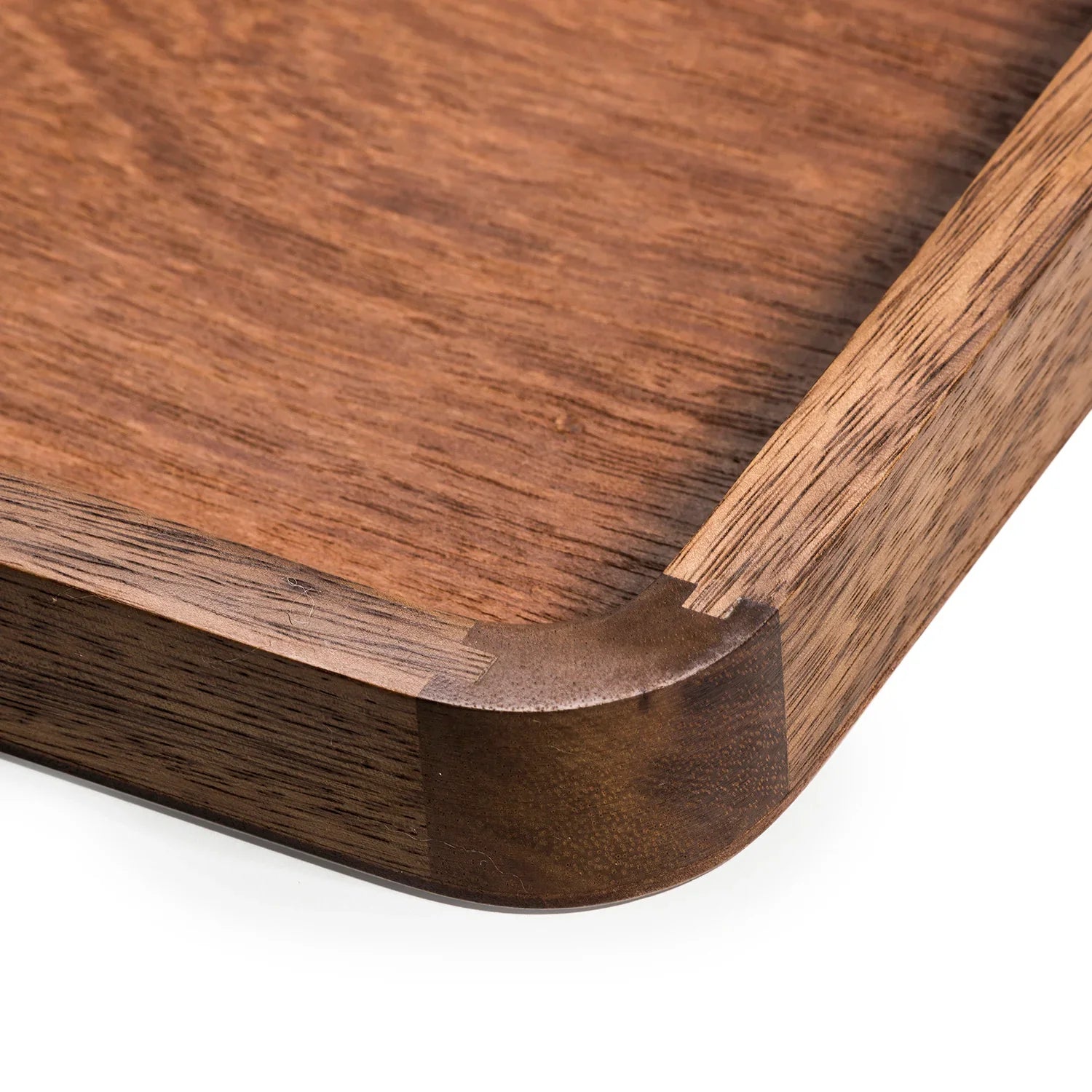 Close-up of a handcrafted wooden tray with smooth finished edges at Qu!rk Boutique