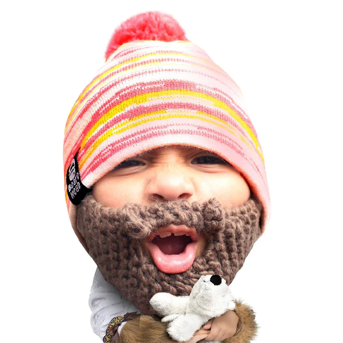 Child wearing striped pink beanie with pom pom and brown knit fake beard holding white plush toy