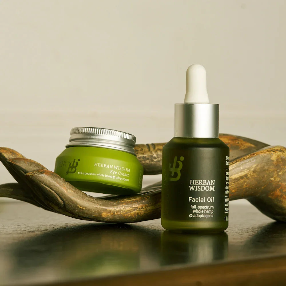 Herban Wisdom facial oil and eye cream on a wooden dish at Qu!rk Boutique & Gift Shop