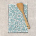 Floral teal kitchen towel with wooden spatula on neutral fabric, Qu!rk Boutique gift
