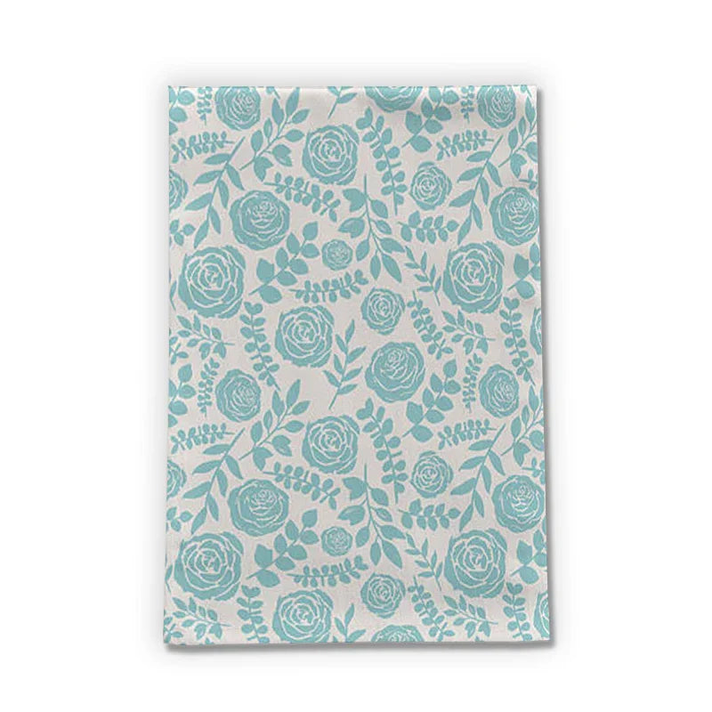 Artist-designed tea towel with blue floral pattern on white, Qu!rk Boutique gift shop decor