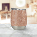 Insulated floral tumbler with rose gold and white line art, on marble at Qu!rk Boutique