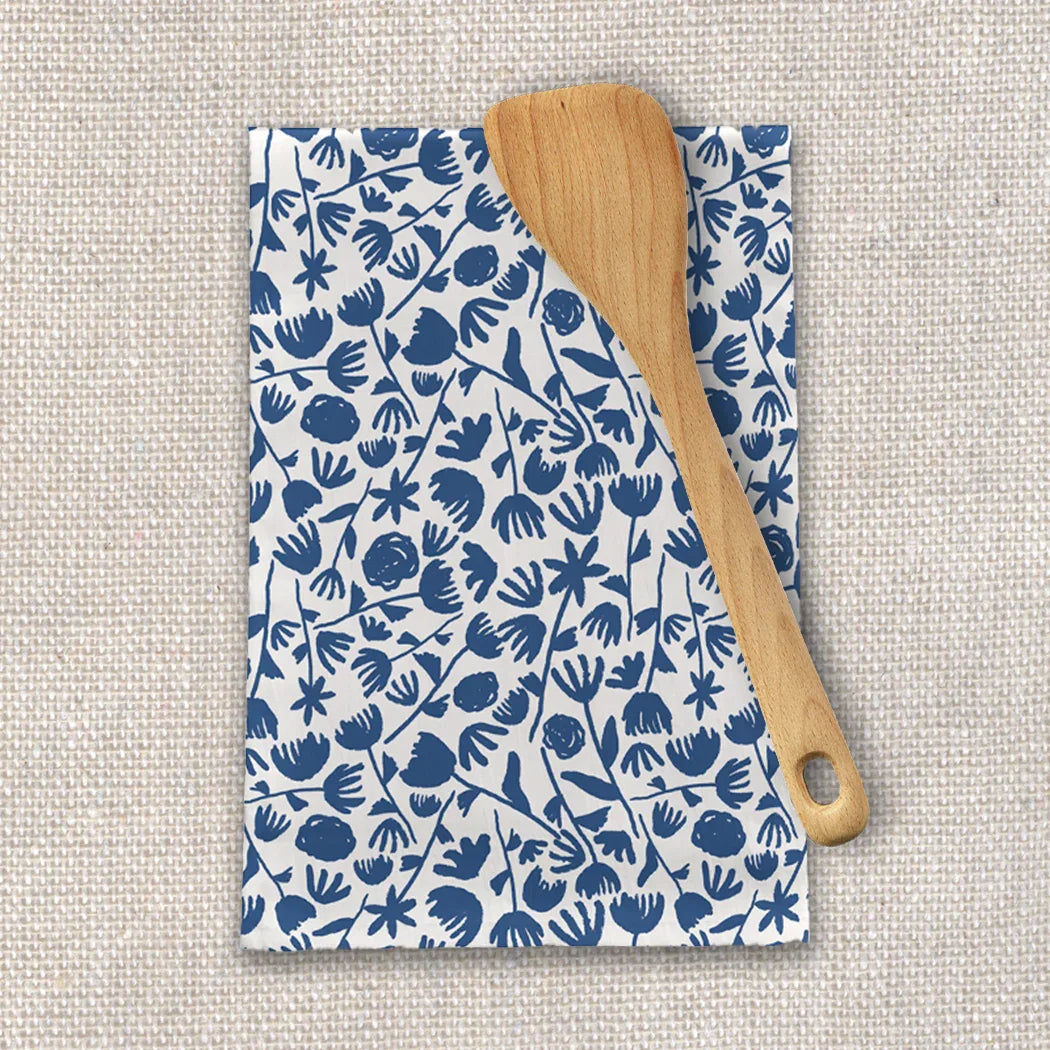 Blue and white floral tea towel with wooden spatula on linen background, Qu!rk Boutique gift