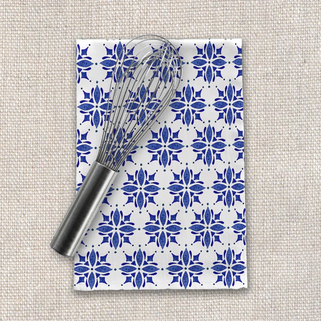 Blue floral patterned tea towel with a metal whisk on textured fabric, Qu!rk Boutique gift.