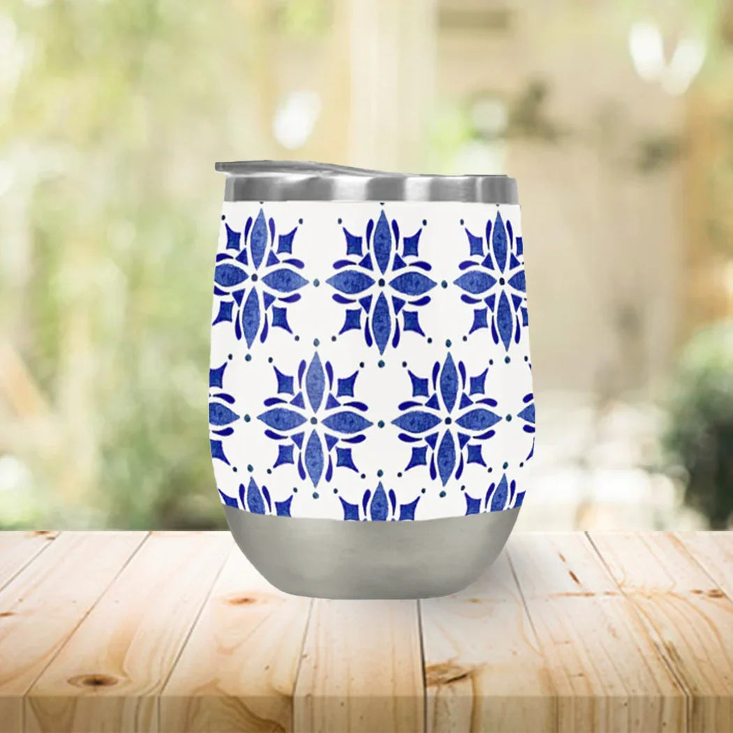 Qu!rk Boutique blue floral patterned insulated stainless steel tumbler on wood table