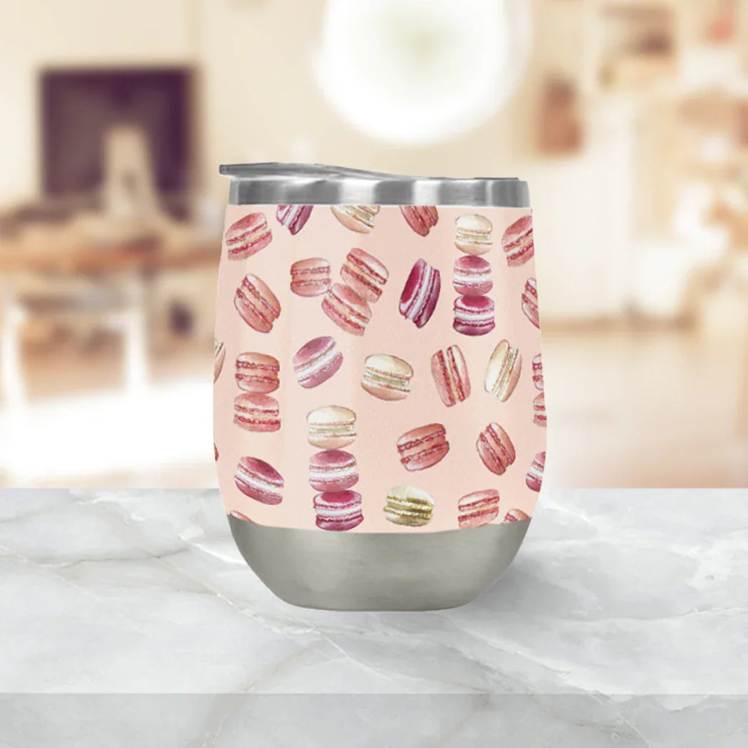 Stainless steel tumbler with pastel macaron pattern, displayed on marble at Qu!rk Boutique