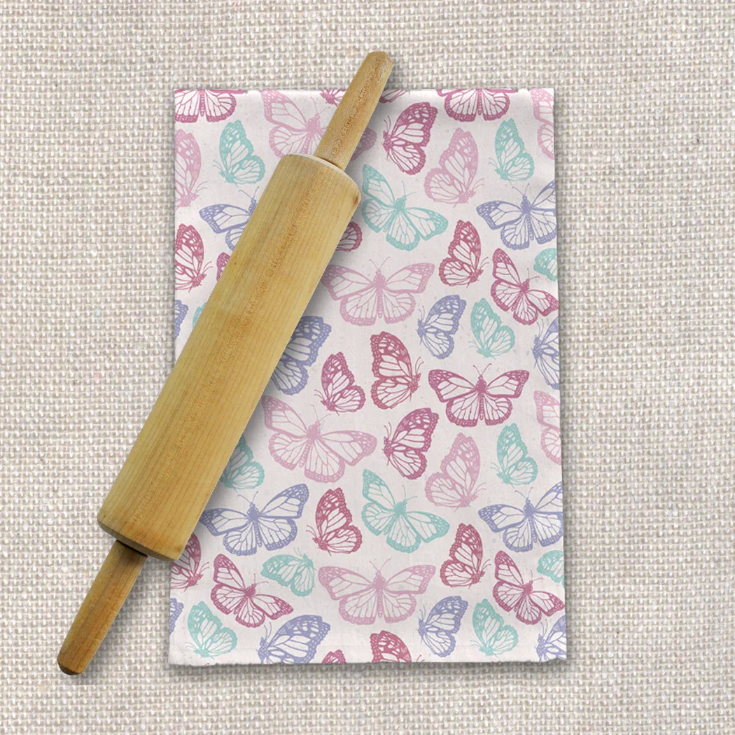 Pastel butterfly tea towel and wooden rolling pin on textured fabric, Qu!rk Boutique kitchen gift