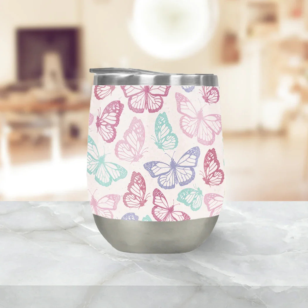 Pastel butterfly stainless steel tumbler on marble counter from Qu!rk Boutique