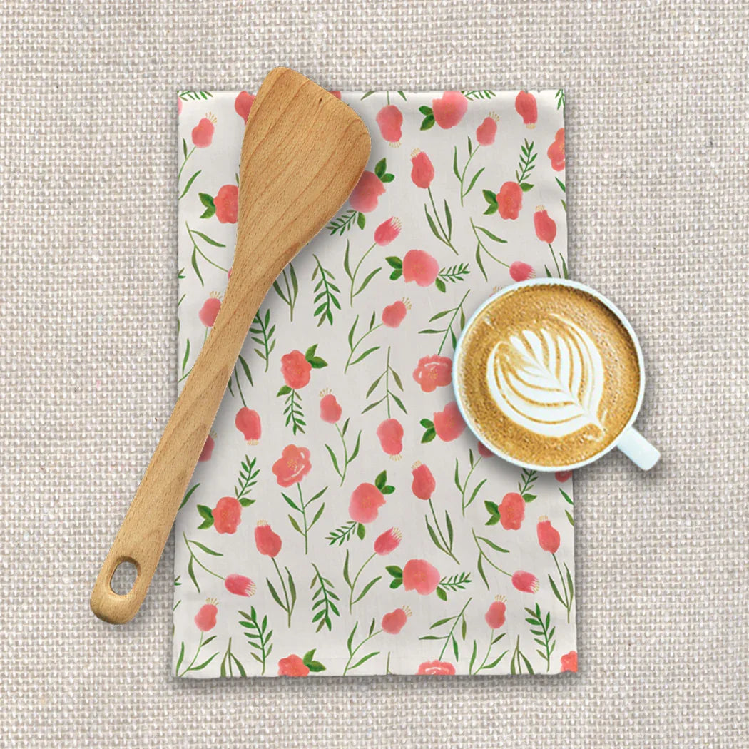 Floral tea towel, wooden spoon, and latte on linen, Qu!rk Boutique kitchen essentials