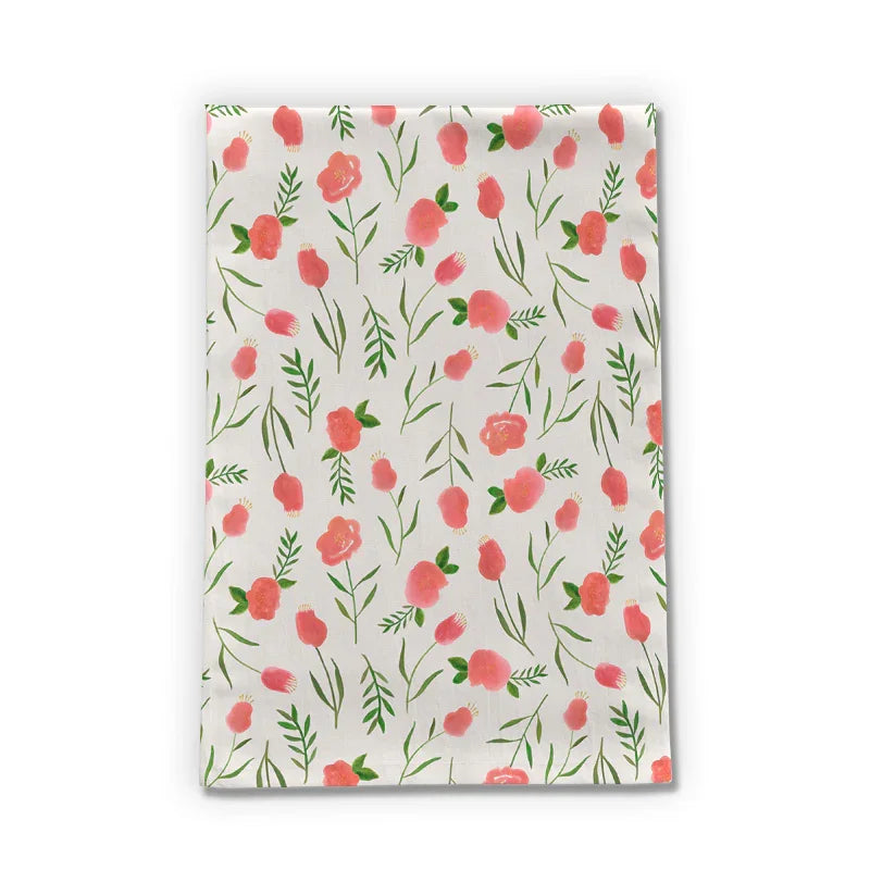 Artisan tea towel with pink floral watercolor design and green leaves on white background