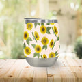 Stainless steel tumbler with sunflower pattern on a wood table, artist-designed at Qu!rk Boutique