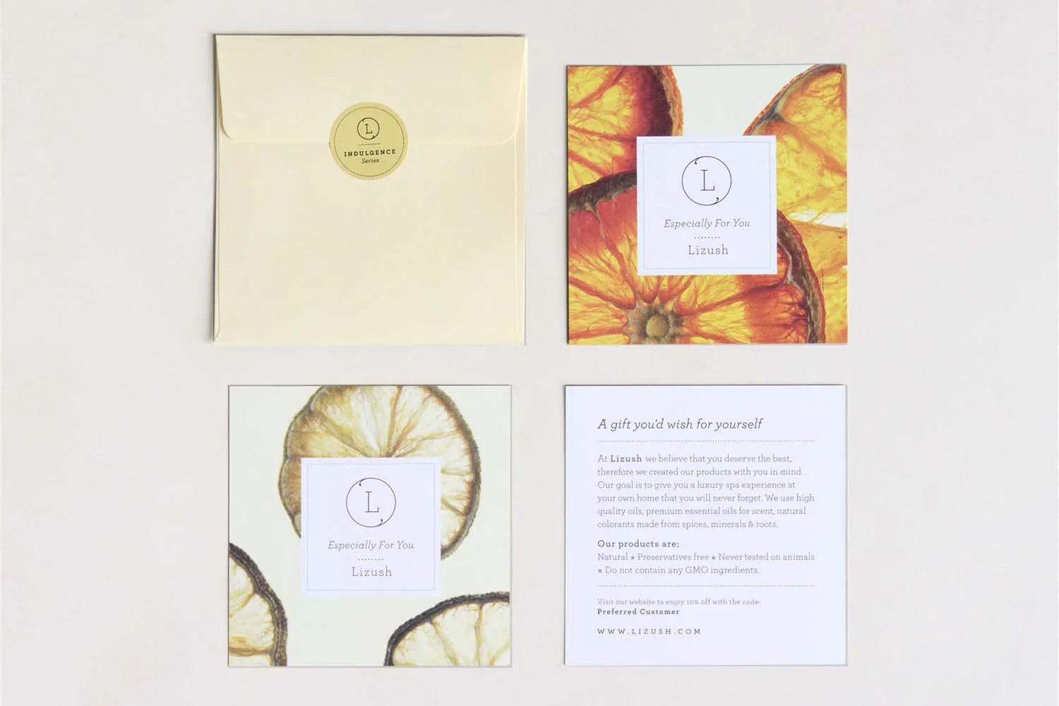 Lizush spa product cards with dried citrus art and luxury branding including envelope and info card