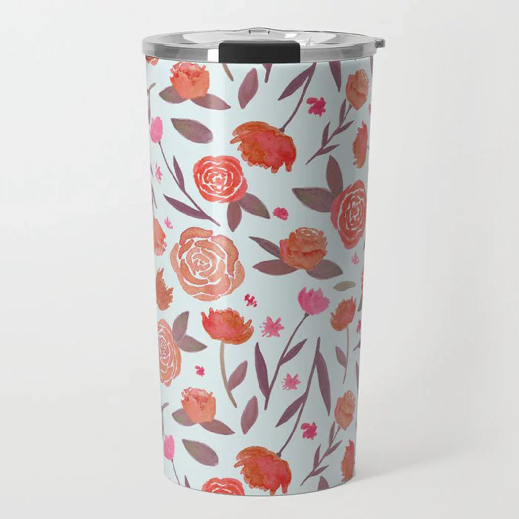 Tall travel tumbler with floral rose and leaf pattern on light blue background