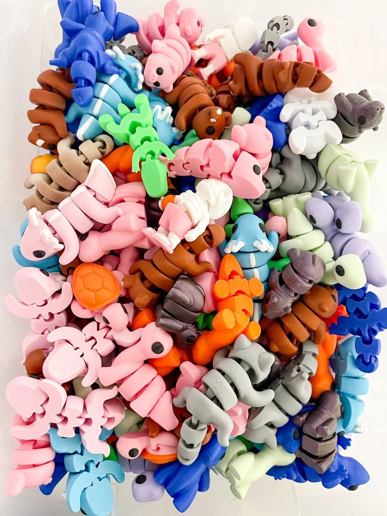 Pile of colorful baby critter figurines, Qu!rk Boutique mystery grab bag gift item