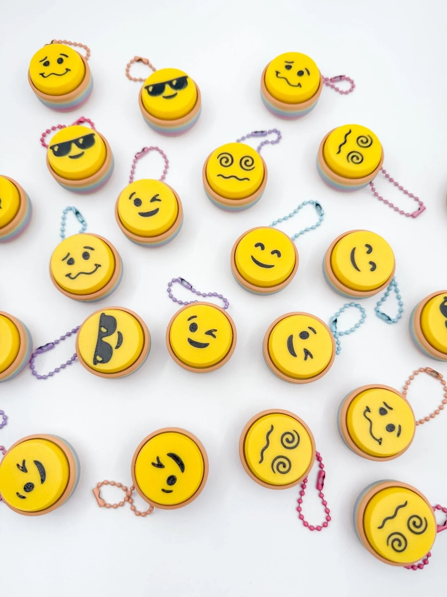 Assorted emoji keyboard clickers with colorful chains, novelty gifts at Qu!rk Boutique.