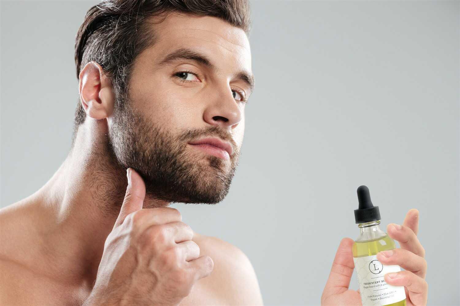 Man with beard holding and applying natural handmade beard oil with dropper bottle