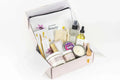 Natural lavender spa gift box with skin care products, candle, soap, mist, and pouch