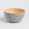 Artist-designed bamboo bowl with black crackle-patterned exterior and natural wood interior