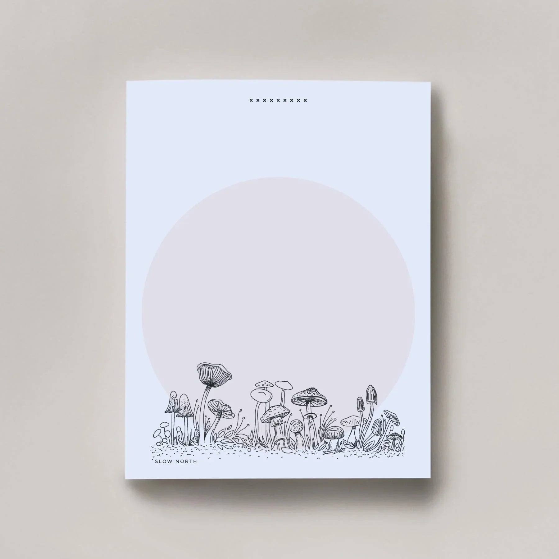 Minimalist notepad with black ink wild mushroom illustration and pale pink circle background