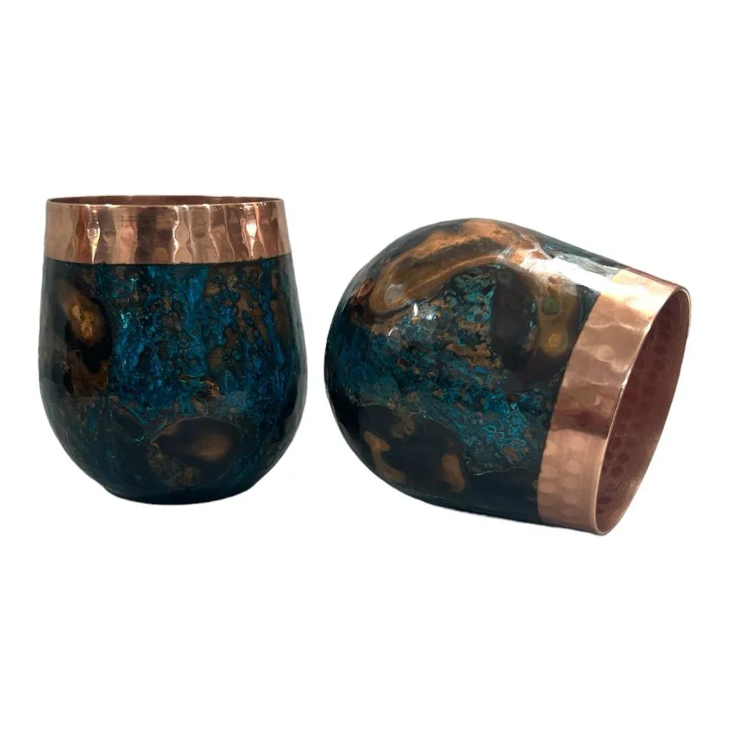 Pair of hammered copper and blue patina tumblers from Qu!rk Boutique, artist-designed drinkware