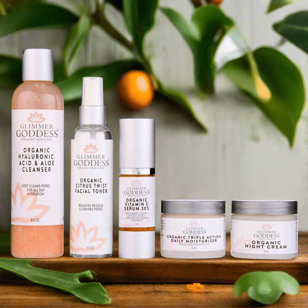 Glimmer Goddess organic skincare set including cleanser, toner, vitamin C serum, moisturizer, and night cream