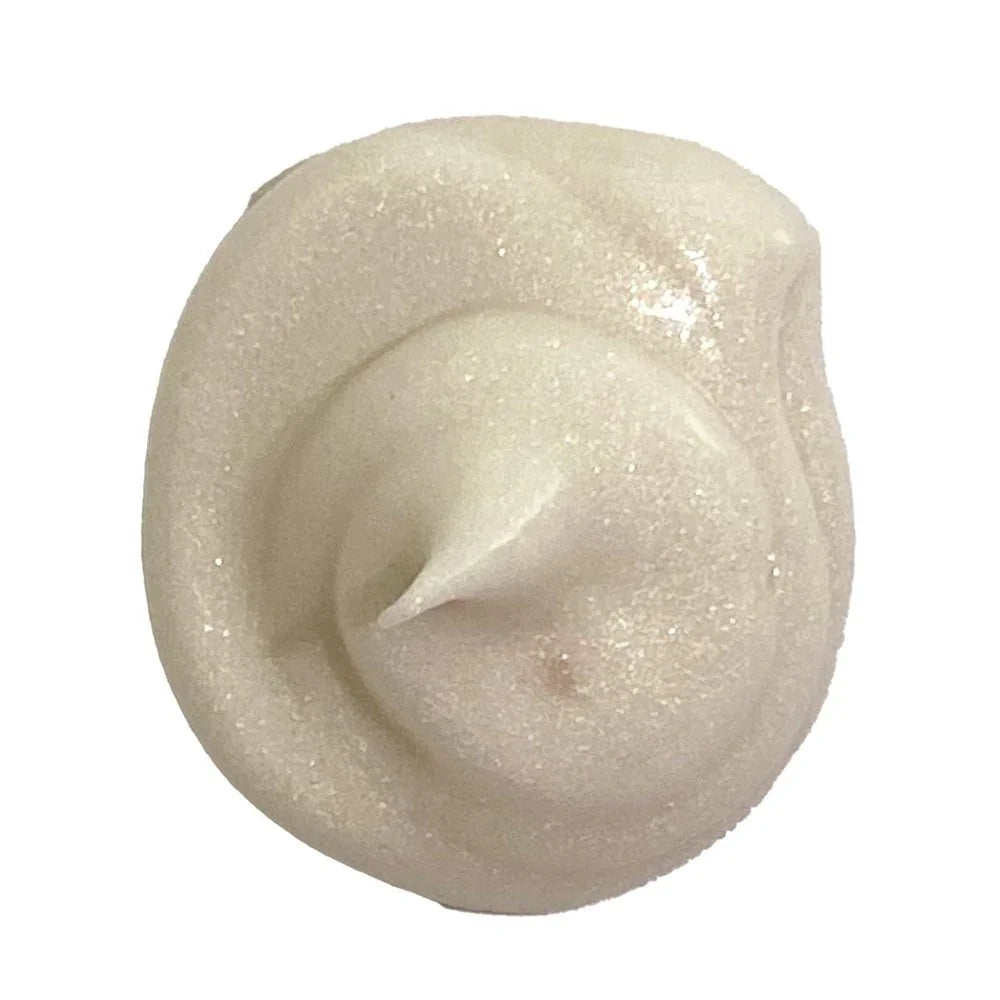 Swirl of shimmering organic gold body lotion with pearly finish, Qu!rk Boutique skincare