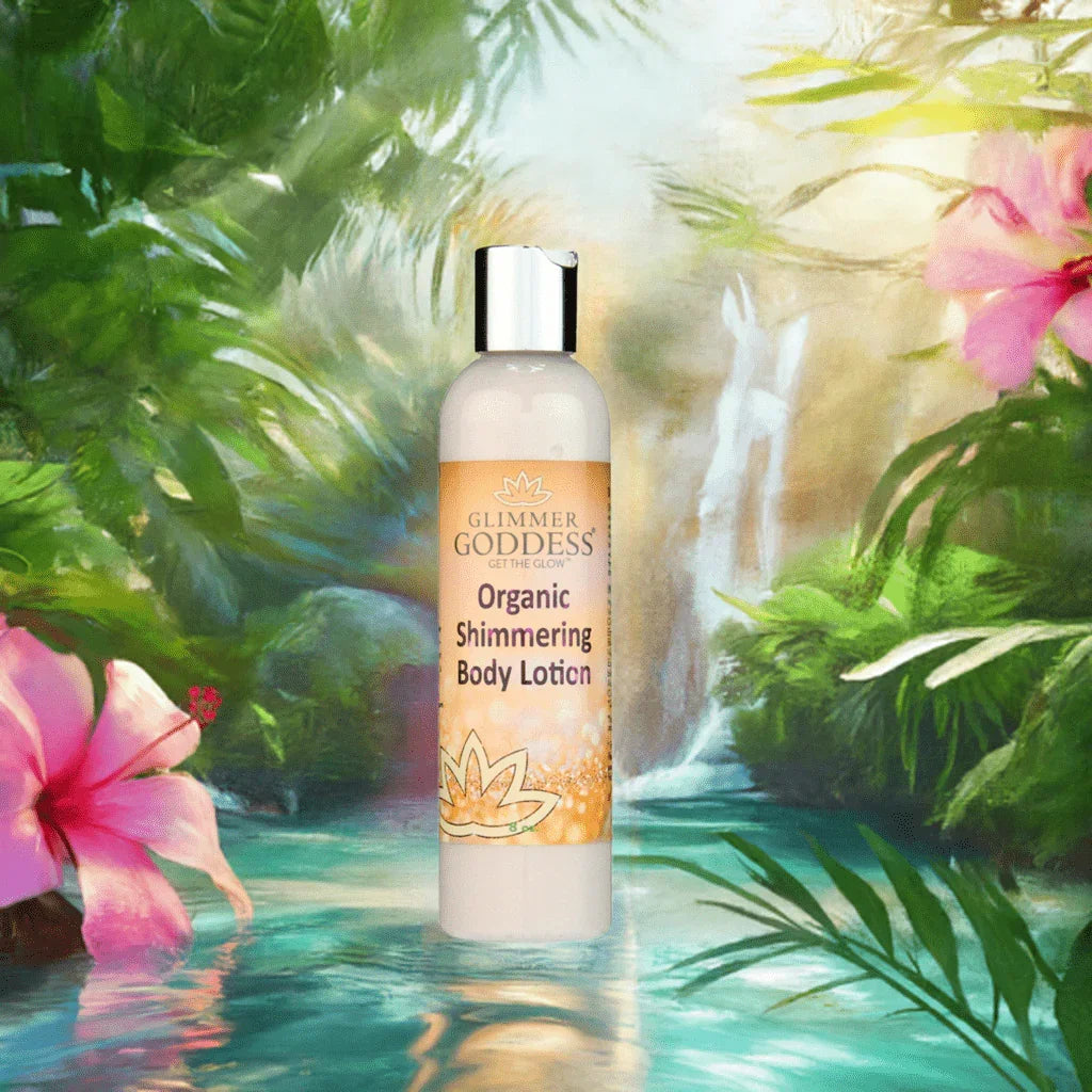 Glimmer Goddess organic shimmering body lotion bottle set in a lush, tropical floral scene