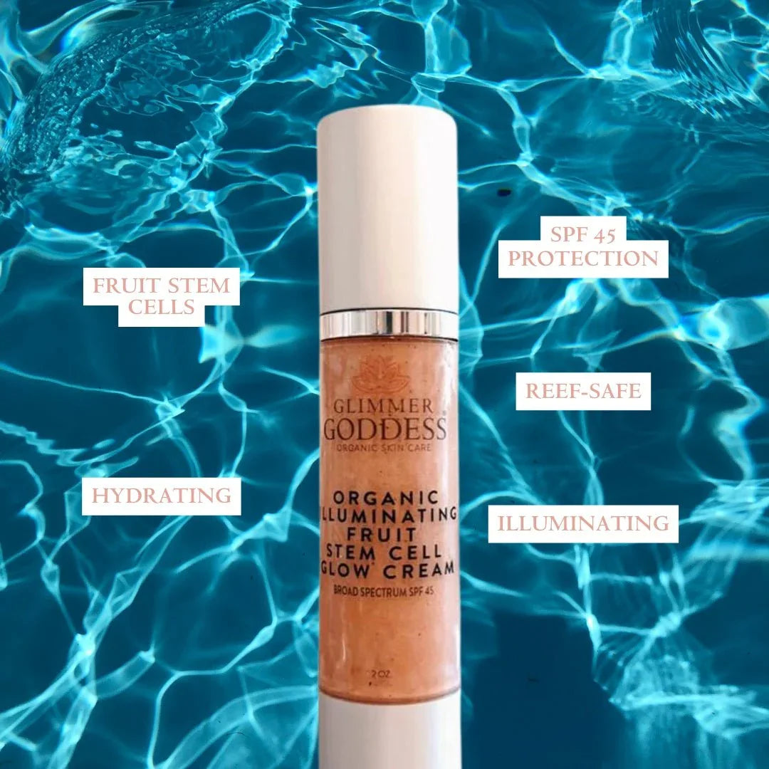 Glimmer Goddess organic illuminating fruit stem cell glow cream SPF 45, reef-safe, hydrating, on a water background.