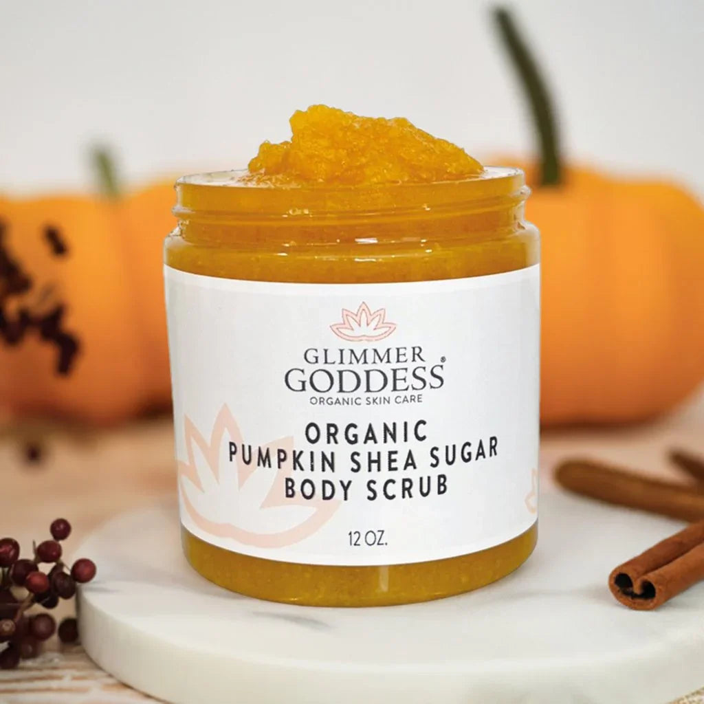 Jar of Glimmer Goddess organic pumpkin shea sugar body scrub with pumpkin and cinnamon sticks