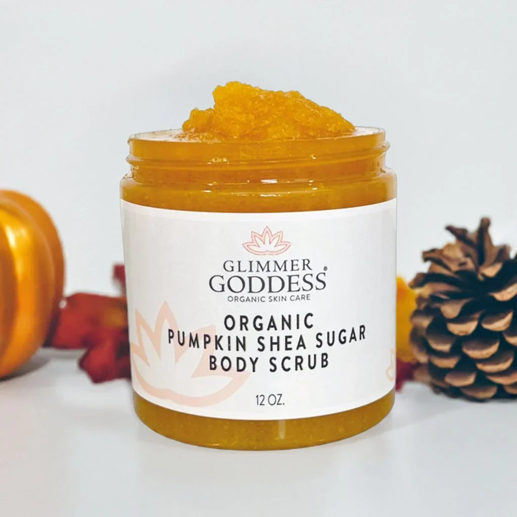 Glimmer Goddess organic pumpkin shea sugar body scrub 12 oz jar with orange scrub inside, pumpkin and pinecone