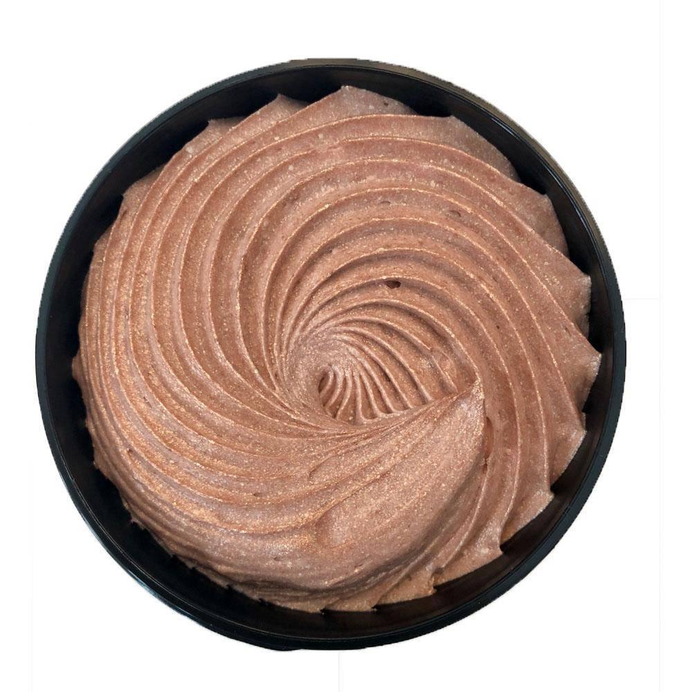 Top view of organic shimmering whipped body butter in a black container with a smooth swirl texture