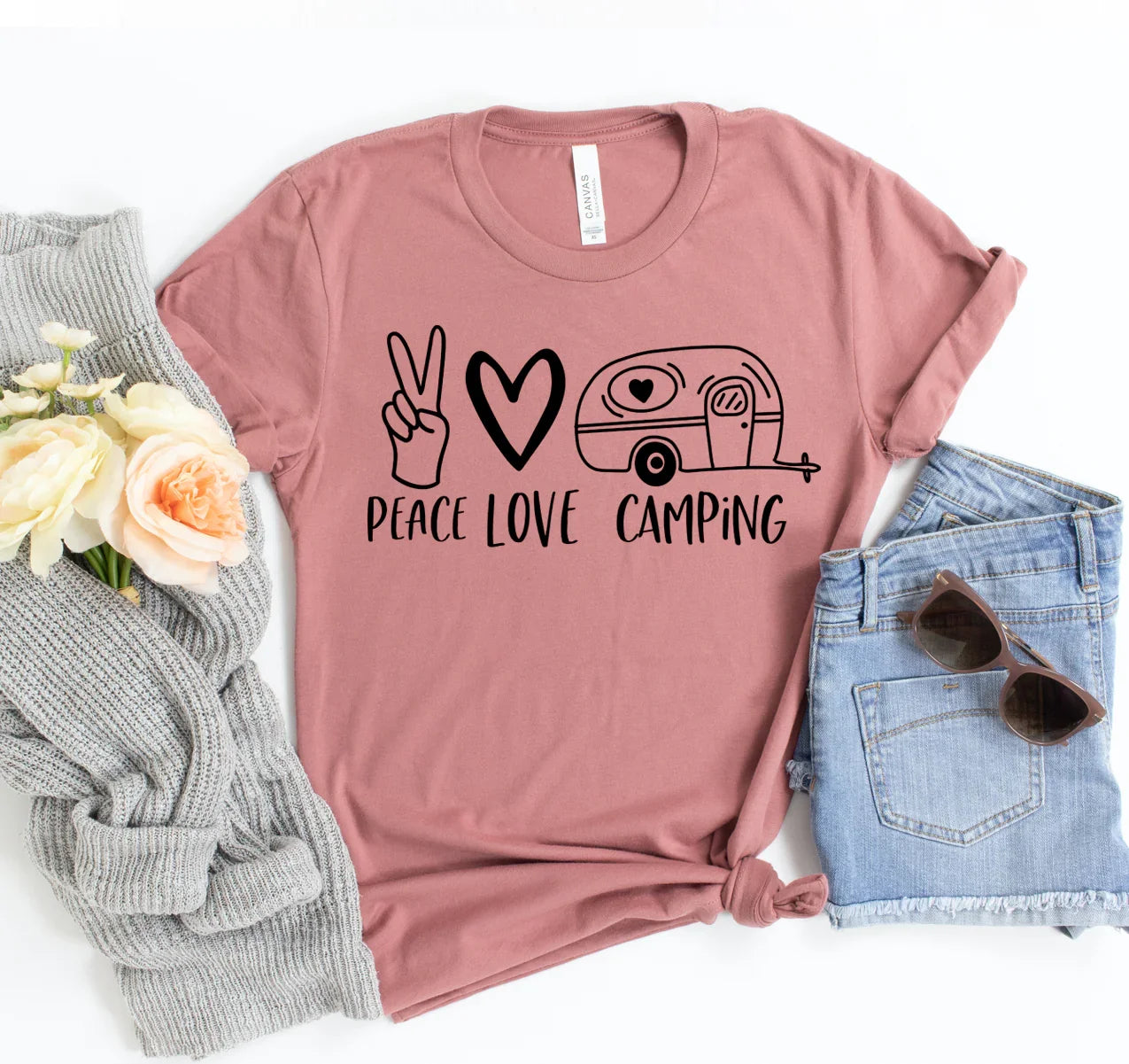 Mauve t-shirt with black peace, heart, and camper graphic and text saying Peace Love Camping